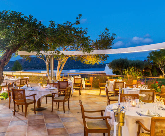 Elounda Bay Palace Aretoussa Restaurant exterior sitting area at night