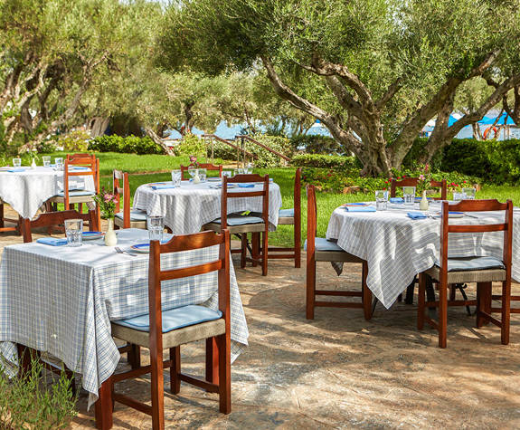 Elounda Beach Kafenion Restaurant sitting area next to the garden