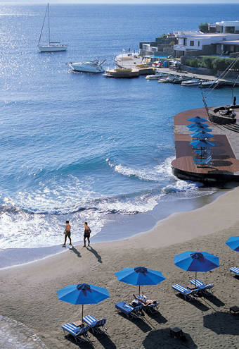 Elounda Bay beach, umbrellas and sunbeds