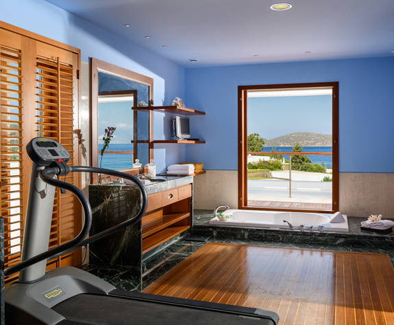 Elounda Bay Palace penthouse suite bathroom with a treadmill