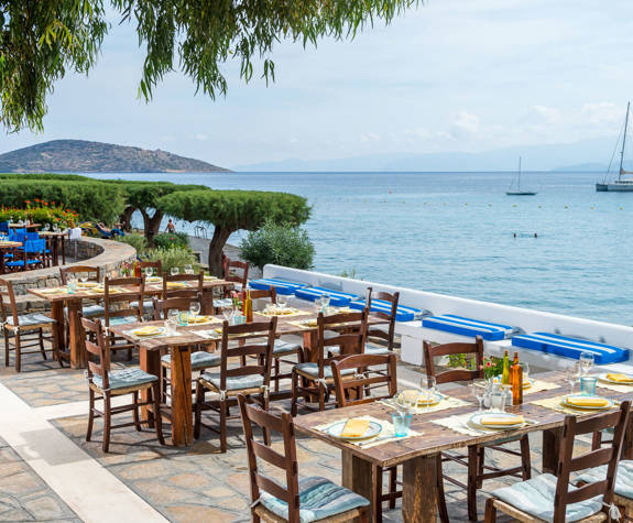 Elounda Bay Palace Ariadne Restaurant with the sea in the background