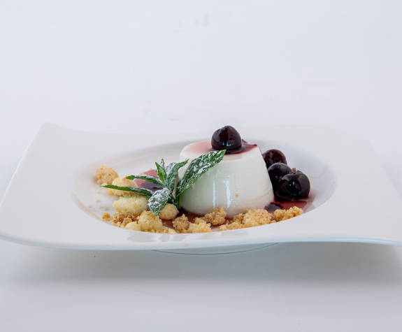 Elounda Beach Hotel Argonaut Restaurant Almond Milk Pannacotta Flavored With Rose Syrup Sour Cherries And Coconut Crumble